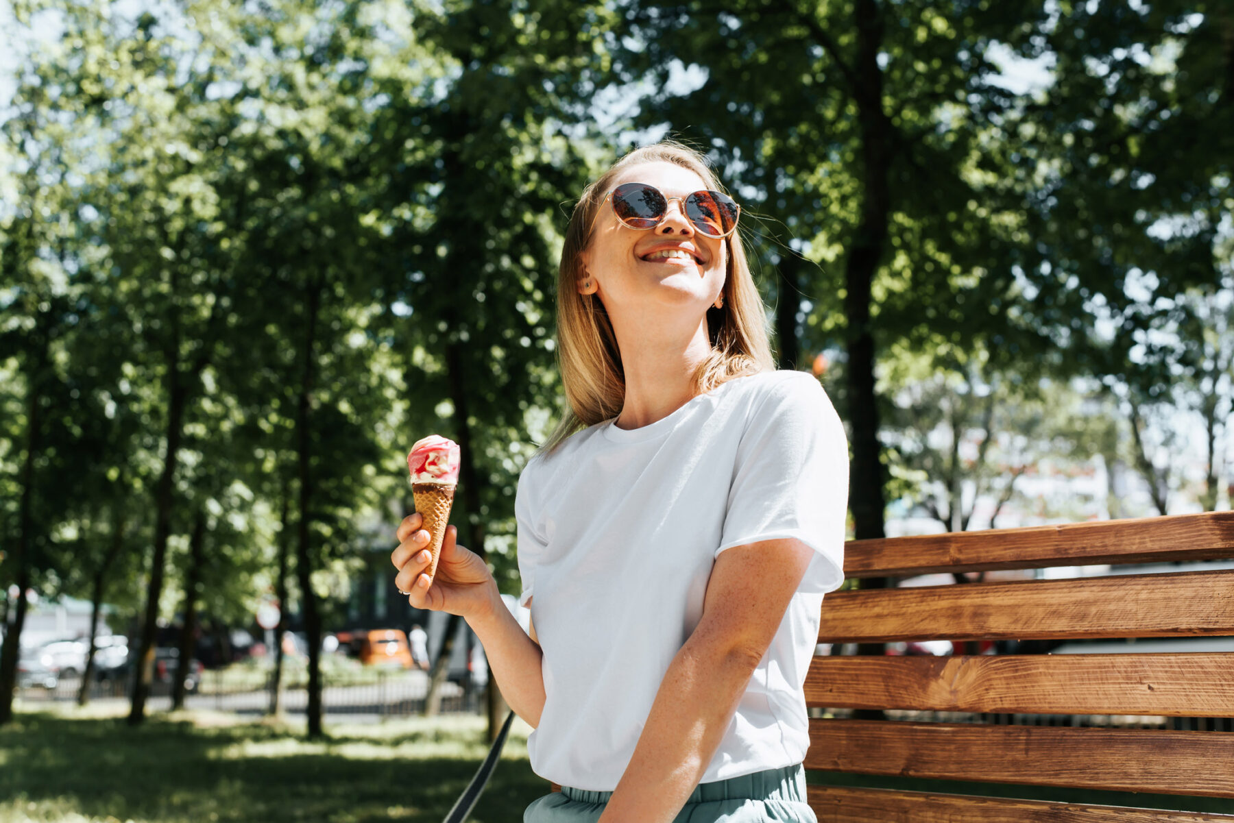 happy lady eating ice cream in denver park