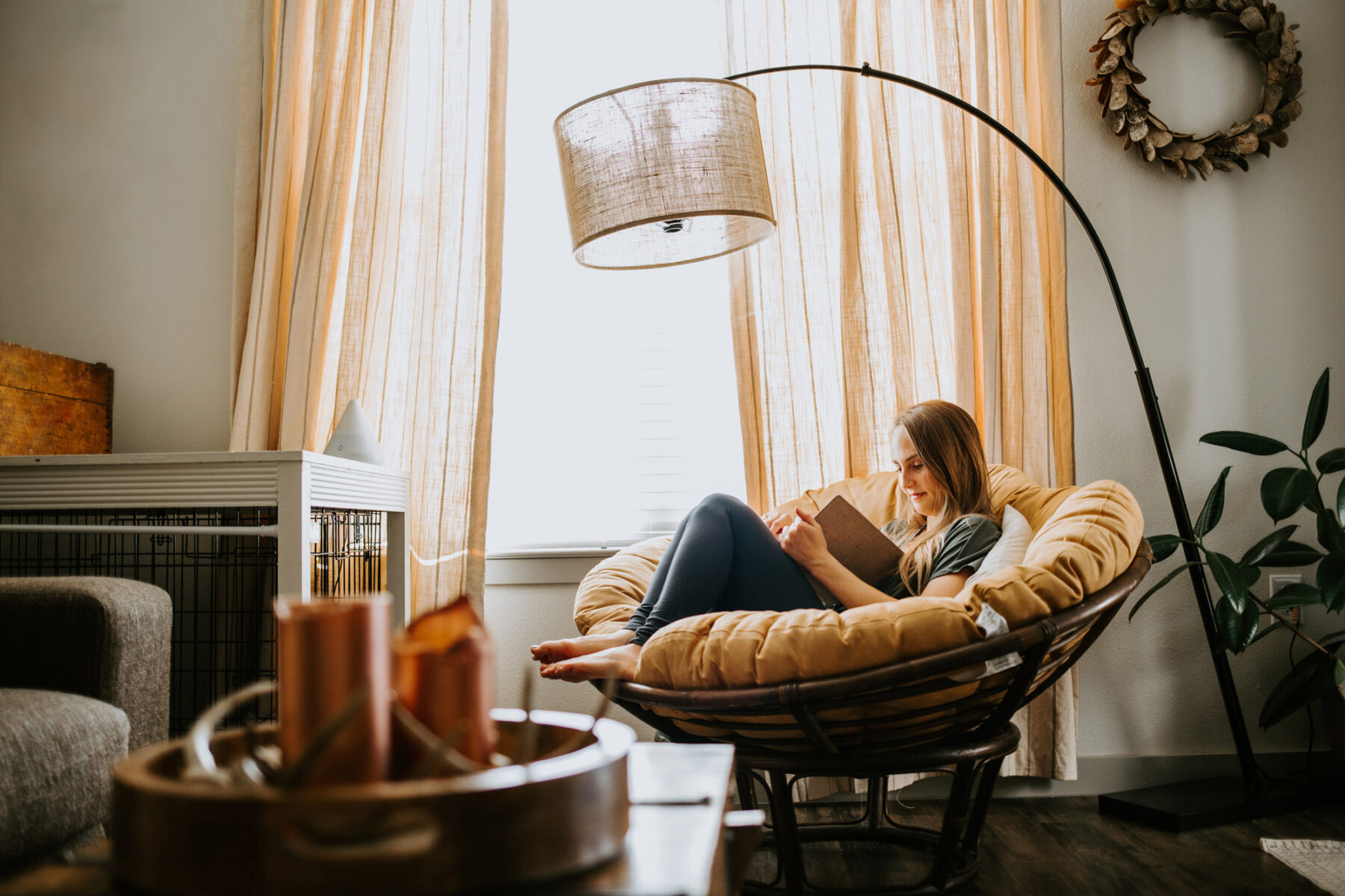 woman reading and relaxing in luxury apartment
