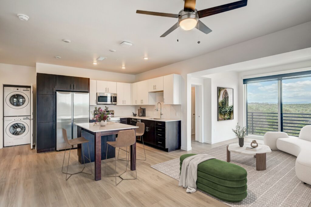 Open-concept kitchen and living room at Vine at Panorama luxury apartments in Denver, CO