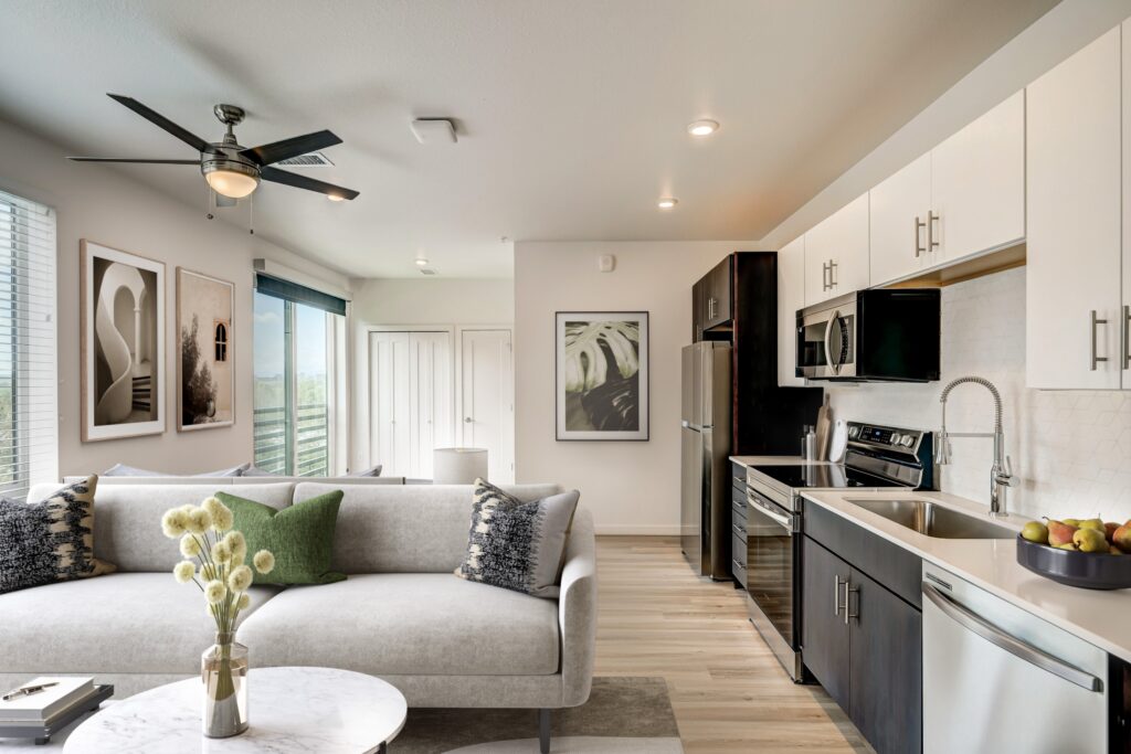 Vibrant kitchen and living room space at Vine at Panorama in Denver, CO