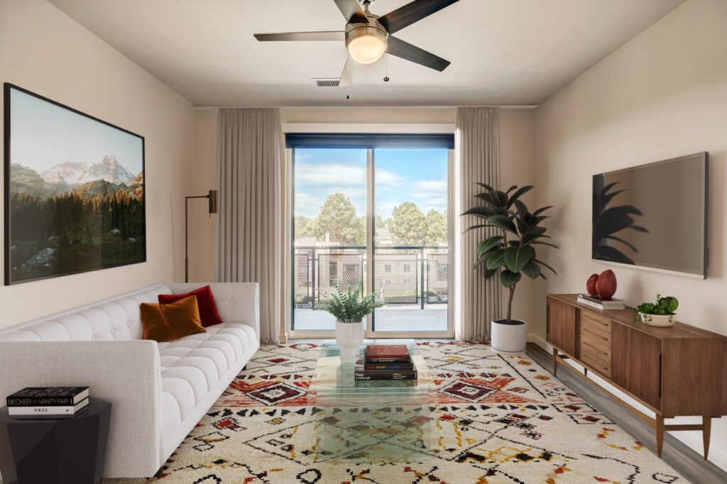 Living room with balcony at Vine at Panorama luxury apartments in Denver, CO