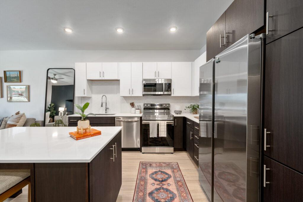Kitchen and dining area in one-bedroom apartment at Vine at Panorama in Denver