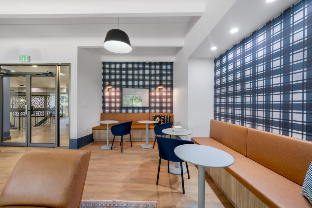 indoor community space with booths, tables and chairs